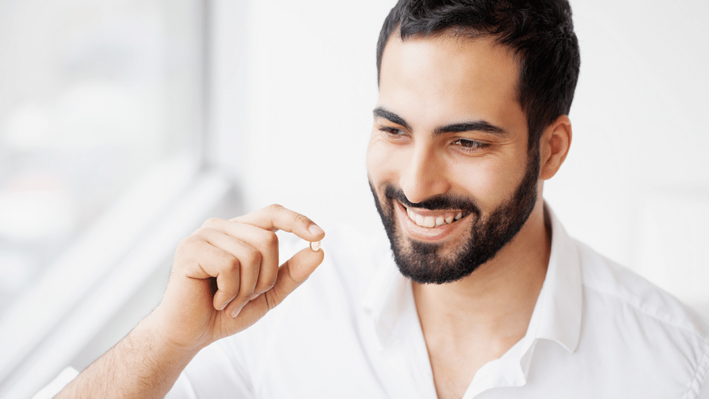 An image of a healthy matured man taking supplements