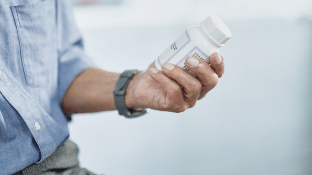 An image of a man looking at the correct dosage of testoluten