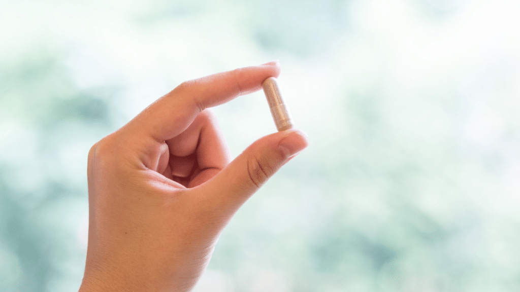 a hand holding supplement