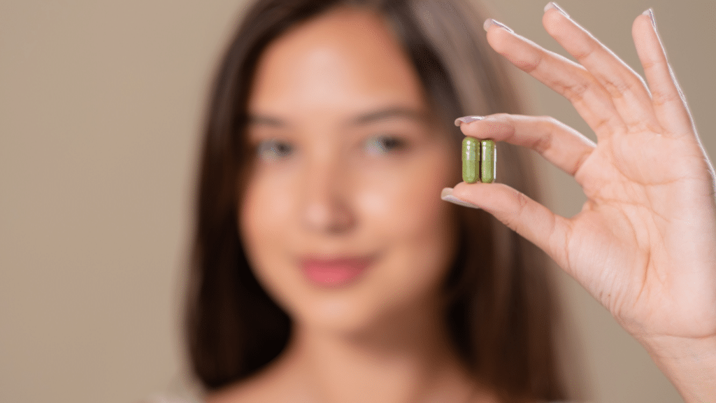 An image of a woman holding a supplement