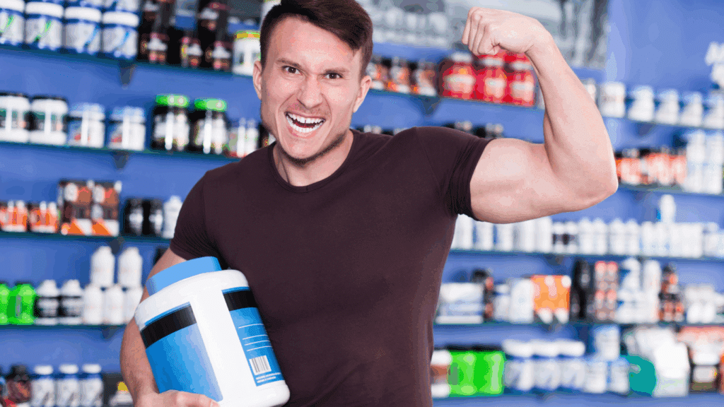An image of an energetic man holding a big supplement bottle