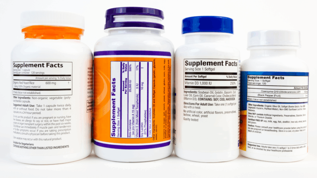 A set of four canisters containing various supplements.