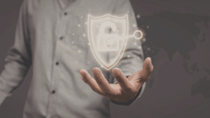 Person holding a glowing digital shield with an unlocked padlock and key symbol, representing cybersecurity, data protection, and secure access.