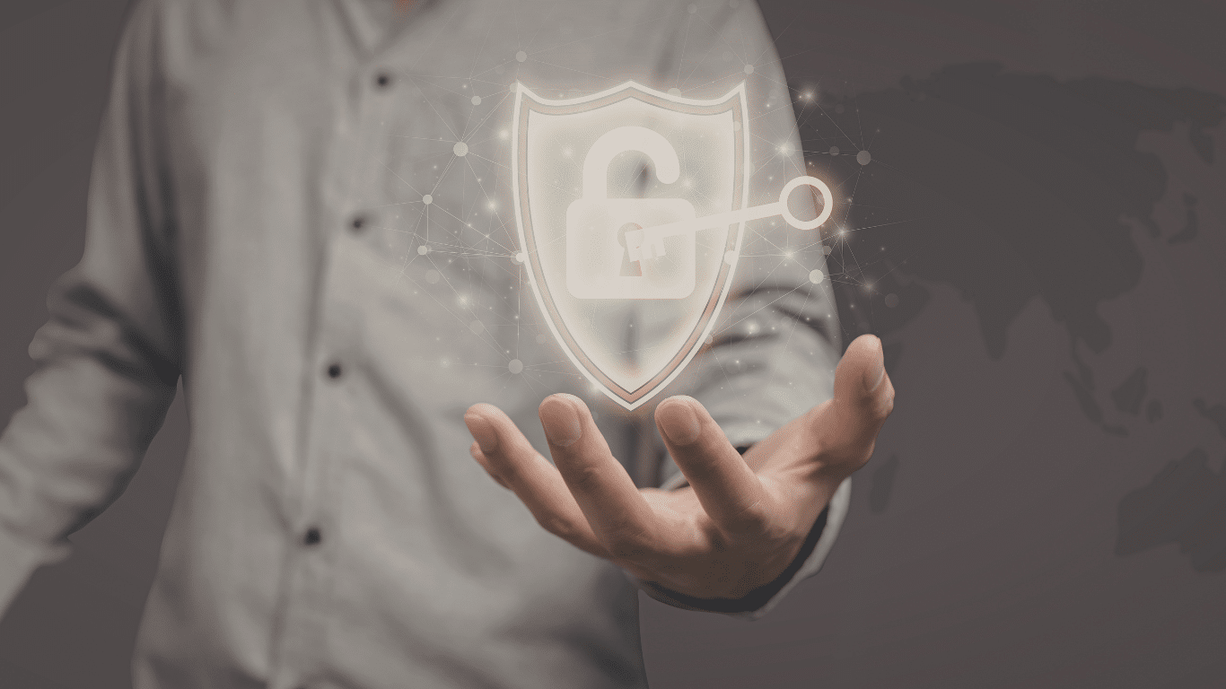 Person holding a glowing digital shield with an unlocked padlock and key symbol, representing cybersecurity, data protection, and secure access.