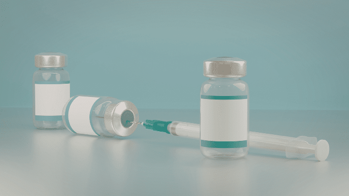 288.png: A digital rendering of three medical vials with blank white labels and a syringe. The needle of the syringe is inserted into the stopper of one vial, suggesting the preparation of an injection.