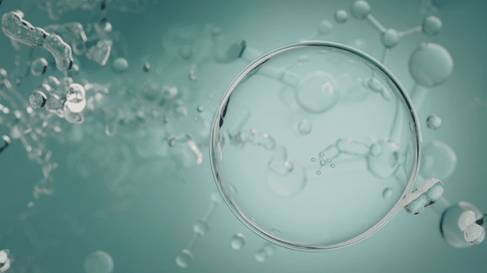 Gemini said A high-quality, scientific 3D visualization featuring a large, transparent spherical molecule centered in the frame. The sphere has a glass-like finish, reflecting a microscopic environment.