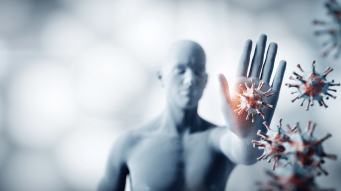 A 3D illustration of a translucent human figure holding up a hand in a "stop" gesture. A glowing virus particle is blocked by the palm, with several other virus particles floating in the foreground.