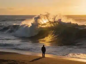 A man staring at the turning tide