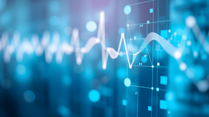 An abstract, futuristic digital graphic in shades of blue. A bright white, pulsing waveform or EKG-like line cuts horizontally across the image, overlaying blurred bokeh circles, vertical grid patterns, and glowing cyan data squares.